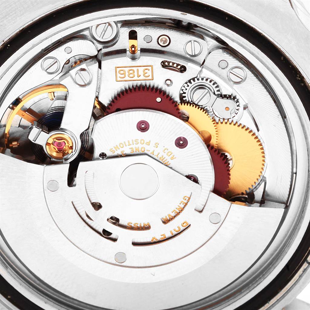 This image shows the inner mechanical movement of the Rolex GMT-Master 116710 Men's Stainless Steel Black Dial 116710 Men's Stainless Steel Black Dial watch from a macro angle, highlighting the intricate gears and components.