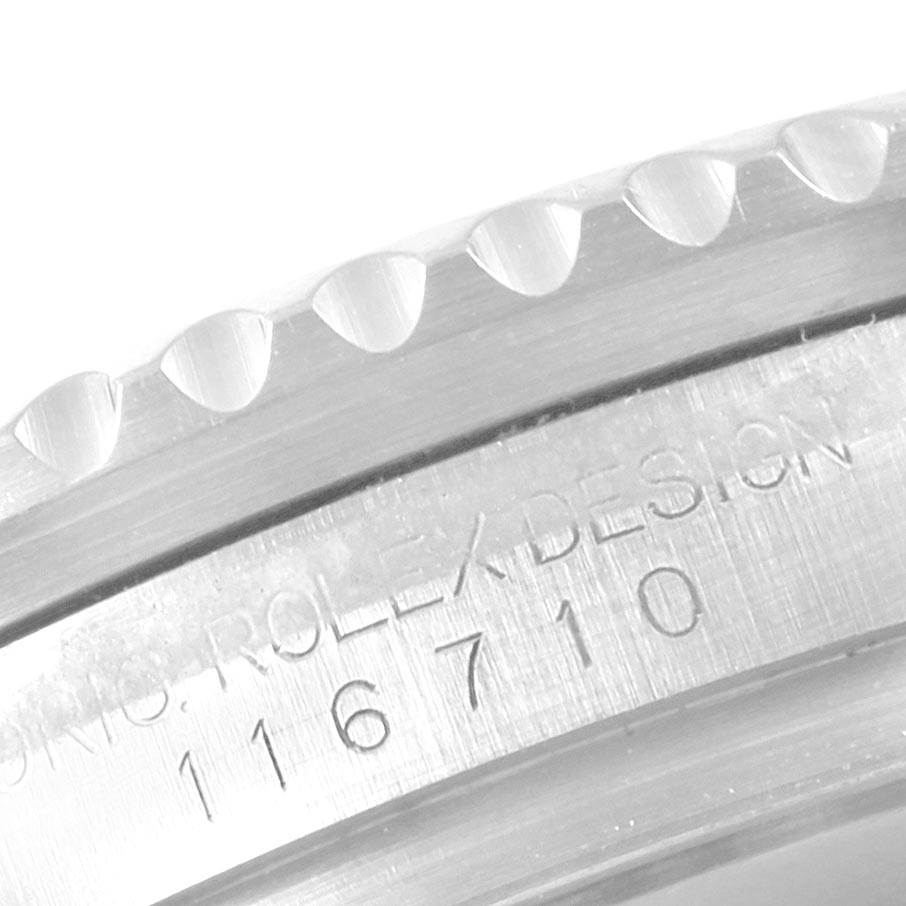 This image shows a close-up of the engraved bezel and case side of a Rolex GMT-Master 116710 Men's Stainless Steel Black Dial 116710 Men's Stainless Steel Black Dial model watch.