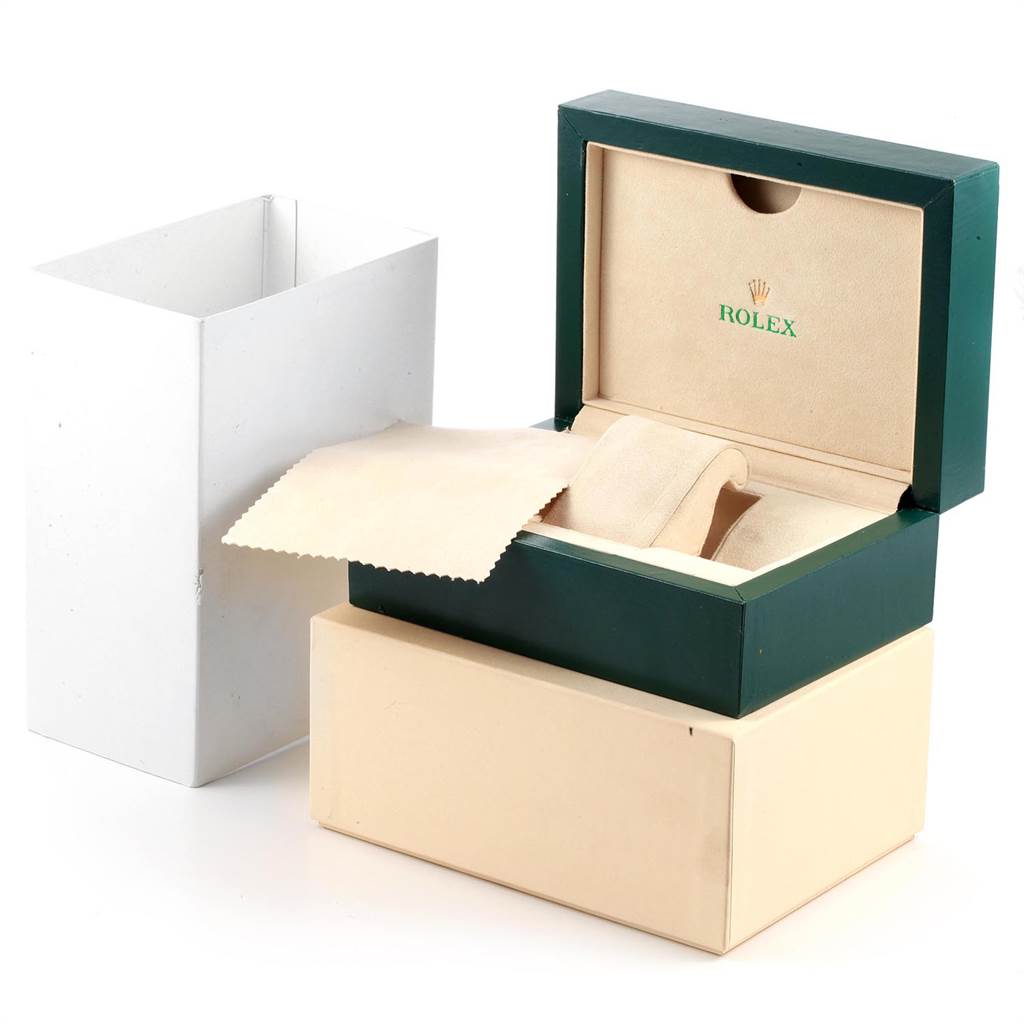 The image shows the open presentation box and cleaning cloth for the Rolex GMT-Master 116710 Men's Stainless Steel Black Dial 116710 Men's Stainless Steel Black Dial watch from an angled side view.