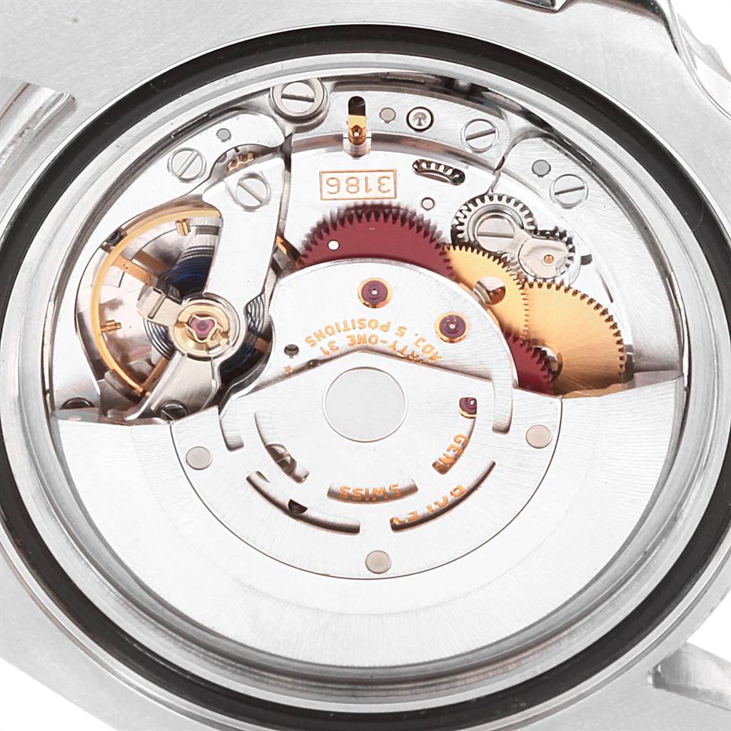 The image shows the movement mechanism of a Rolex GMT-Master 116710 Men's Stainless Steel Black Dial 116710 Men's Stainless Steel Black Dial watch from a close-up, angled from the back.