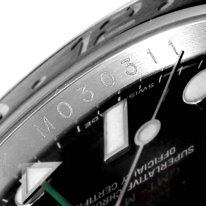The image shows a close-up of the dial and bezel of a Rolex GMT-Master 116710 Men
s Stainless Steel Black Dial 116710 Men
s Stainless Steel Black Dial watch.