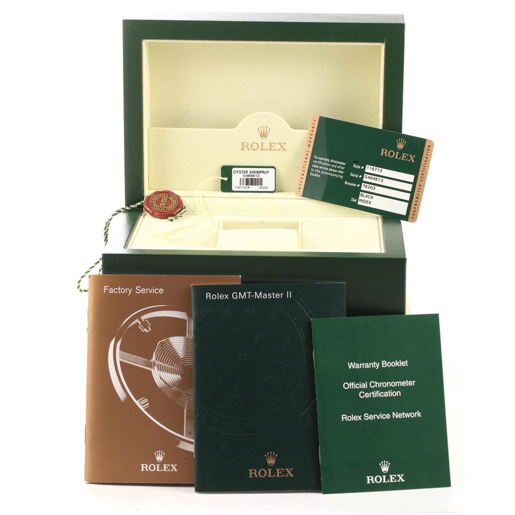 The image shows the packaging and accessories for a Rolex GMT-Master 116713 Men's Stainless Steel Black Dial 116713 Men's Stainless Steel Black Dial II watch, including the box, warranty booklet, and service manuals.