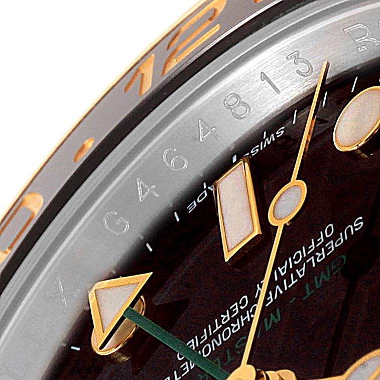 This image shows a close-up of the dial, hour markers, hands, and the bezel of the Rolex GMT-Master 116713 Men's Stainless Steel Black Dial 116713 Men's Stainless Steel Black Dial watch.