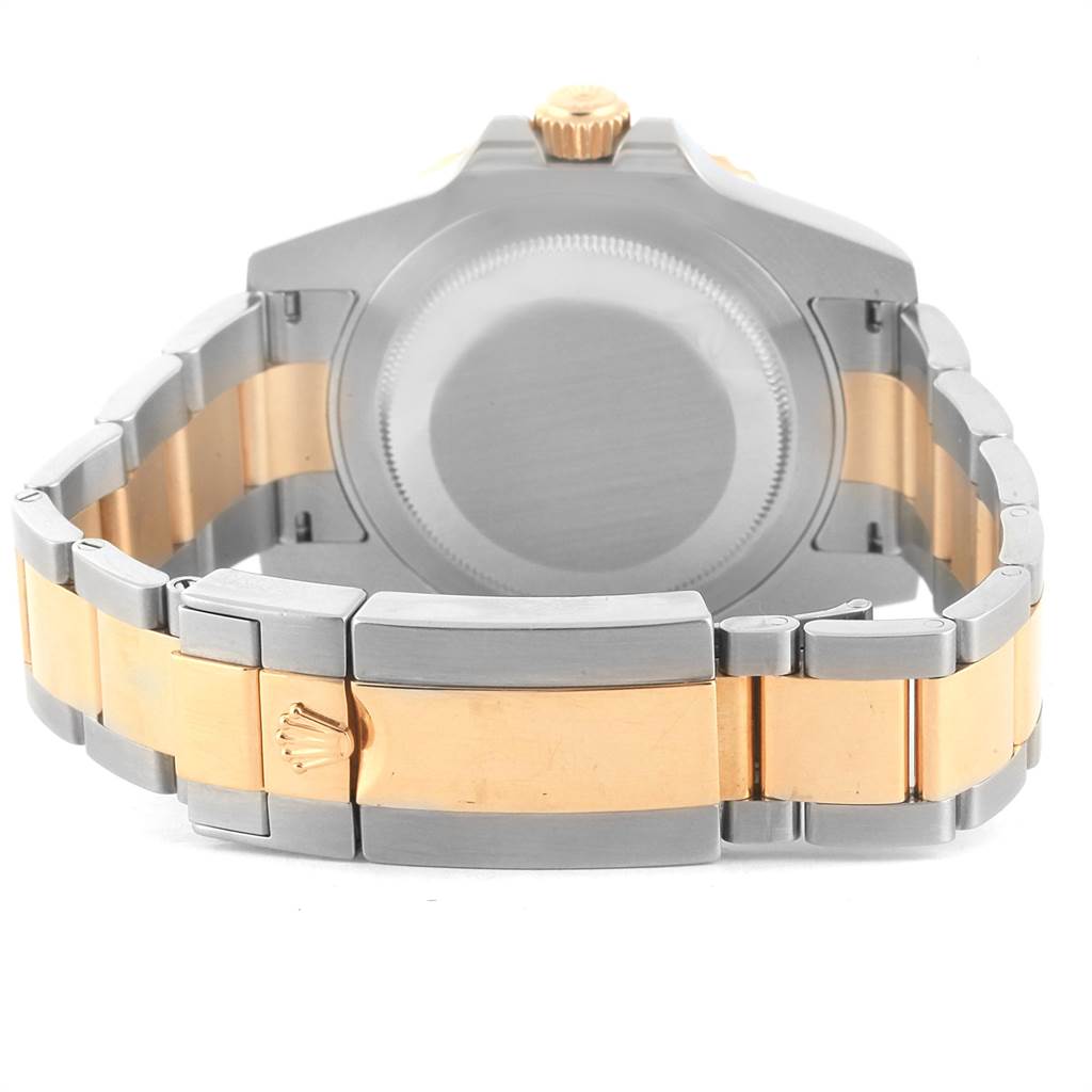 The image shows the back view of a Rolex GMT-Master 116713 Men's Stainless Steel Black Dial 116713 Men's Stainless Steel Black Dial watch, highlighting its clasp, bracelet, and back case.