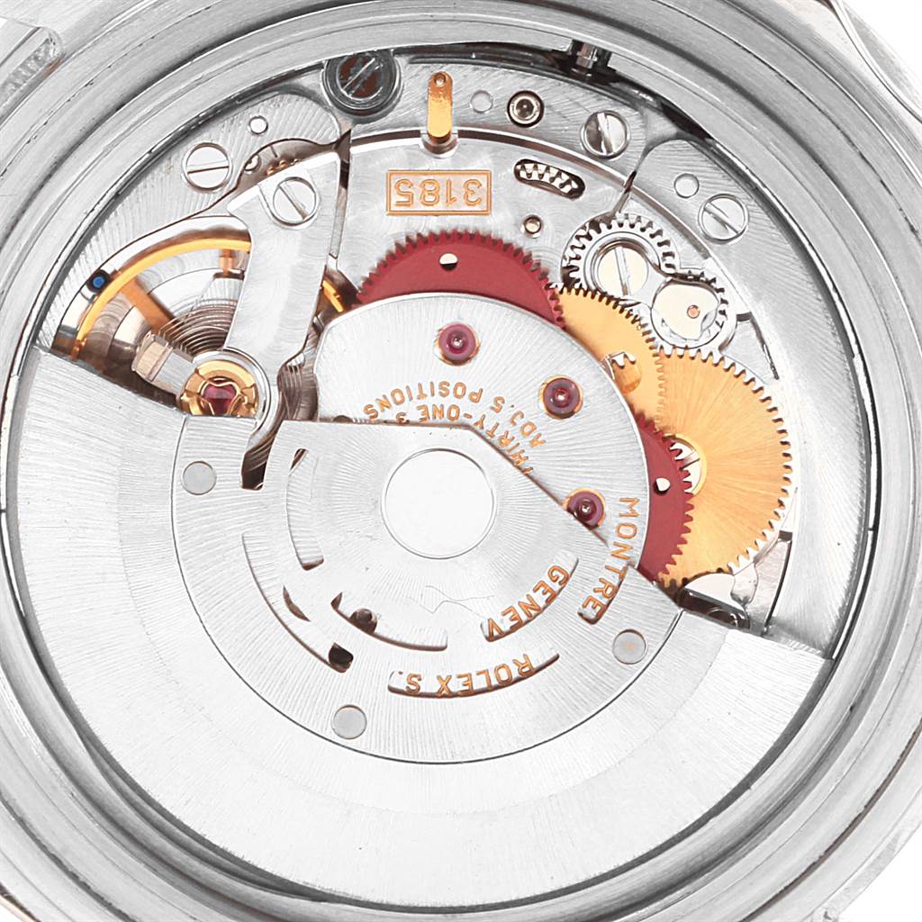 This image shows the intricate movement mechanism of a Rolex GMT-Master 16710 Men's Stainless Steel Black Dial 16710 Men's Stainless Steel Black Dial watch, including gears and the rotor.