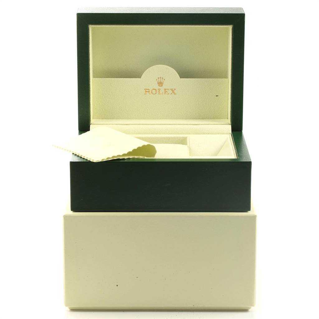 The image shows an open Rolex box for the GMT-Master model, revealing the interior and a cleaning cloth.