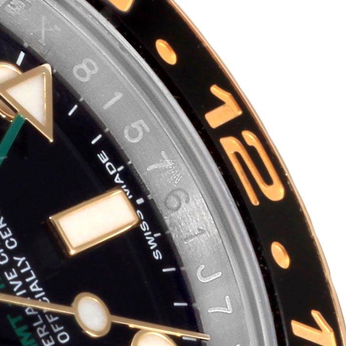 The image shows a close-up of the Rolex GMT-Master 116713 Men's Stainless Steel Black Dial 116713 Men's Stainless Steel Black Dial watch dial and bezel, focused on the 10 to 12 numerals.