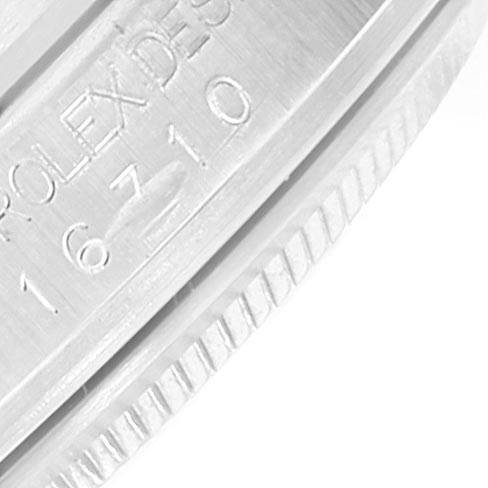 The image shows a close-up of the case edge with engravings on a Rolex GMT-Master 16710 Men's Stainless Steel Black Dial 16710 Men's Stainless Steel Black Dial model watch.