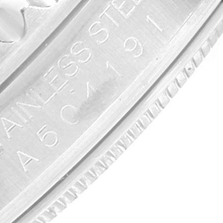 This image shows a close-up angle of the serial number engraved on the case of a Rolex GMT-Master 16710 Men's Stainless Steel Black Dial 16710 Men's Stainless Steel Black Dial watch.
