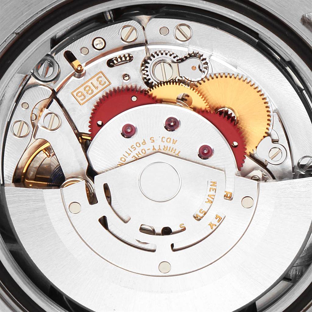 The image shows the movement mechanism of the Rolex GMT-Master 116719 Men's White Gold Black Dial 116719 Men's White Gold Black Dial watch, focusing on the intricate gears and components.