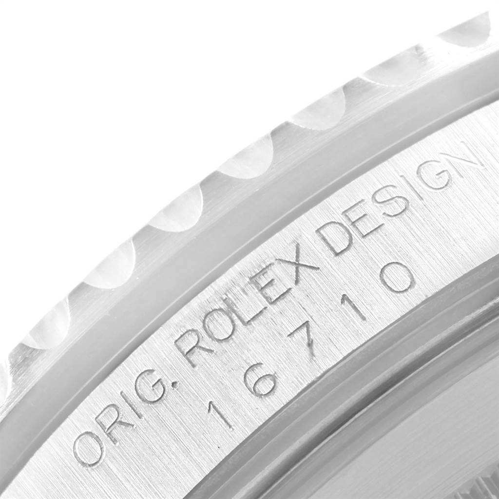 This close-up angle shows the engraved side of a Rolex GMT-Master 16710 Men's Stainless Steel Black Dial 16710 Men's Stainless Steel Black Dial watch with the model number 16710.