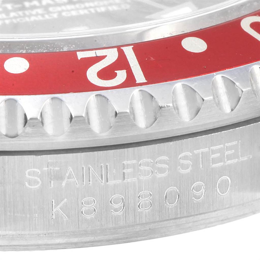 This close-up image shows the bezel and side of the case of a Rolex GMT-Master 16710 Men's Stainless Steel Black Dial 16710 Men's Stainless Steel Black Dial, highlighting the engraved details.