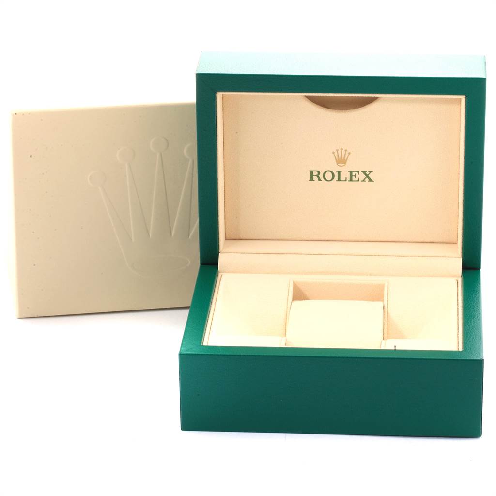The image shows an open green and beige Rolex watch box for the GMT-Master model.
