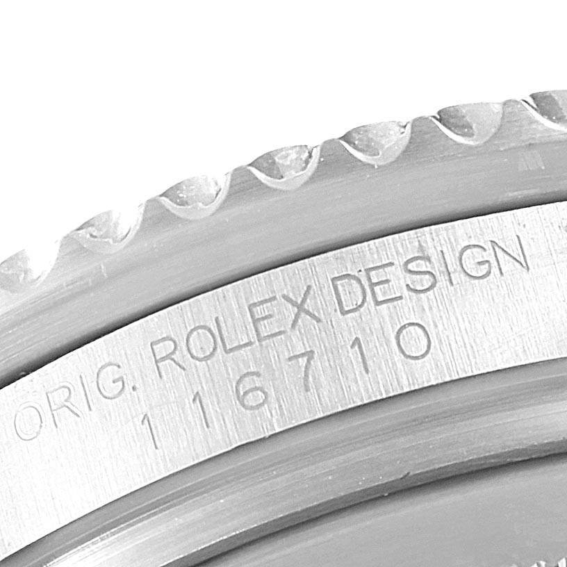Close-up of the serial number and "Rolex Design" engraving on the bezel of a Rolex GMT-Master 116710 Men's Stainless Steel Black Dial 116710 Men's Stainless Steel Black Dial watch.