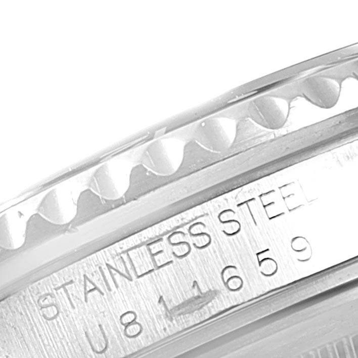 The image shows a close-up of the engraved stainless steel casing and part of the bezel of a Rolex GMT-Master 16700 Men's Stainless Steel Black Dial 16700 Men's Stainless Steel Black Dial watch.