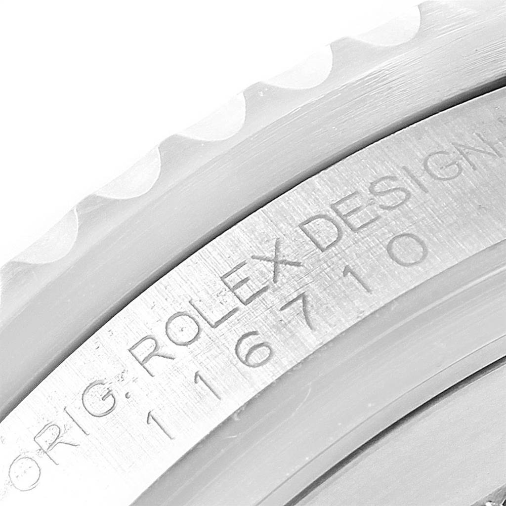 The image shows a close-up of the bezel and engraved side of a Rolex GMT-Master 116710 Men's Stainless Steel Black Dial 116710 Men's Stainless Steel Black Dial watch.