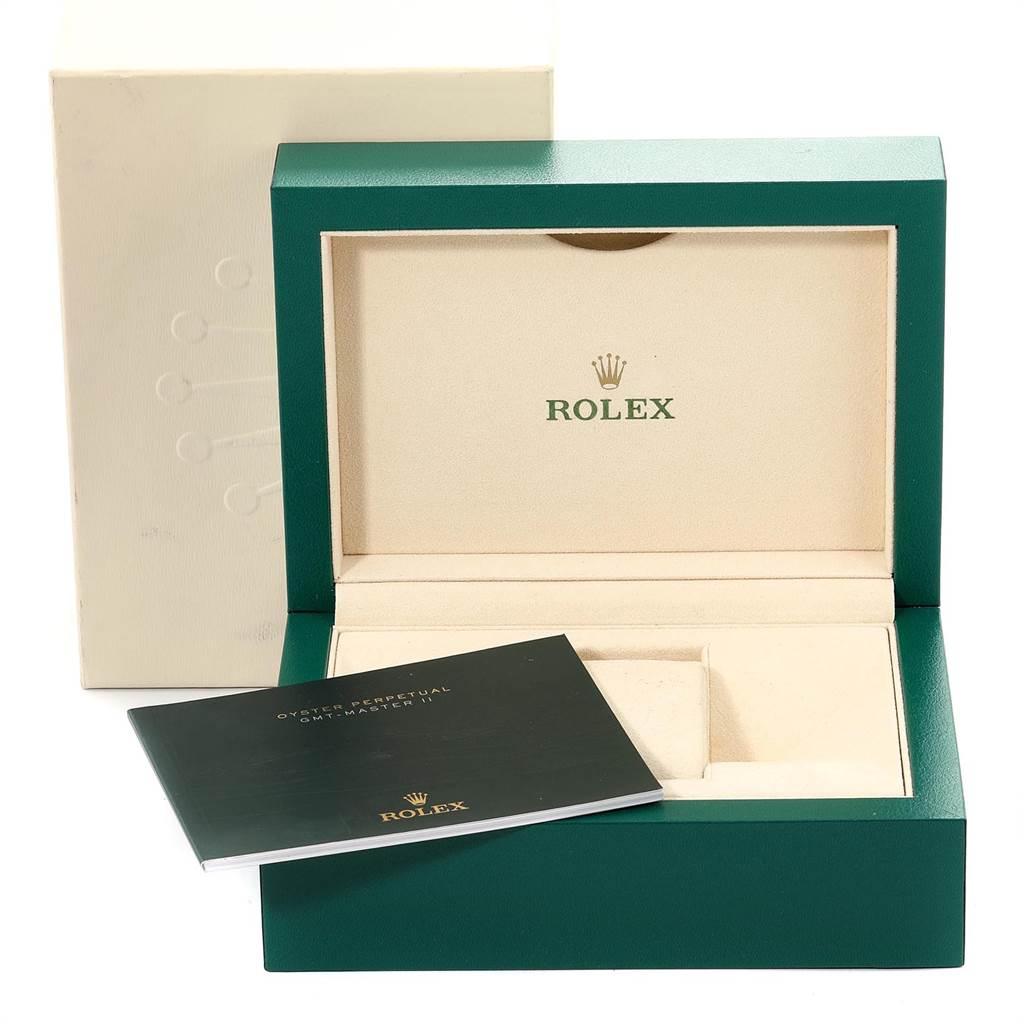 The image shows the opened packaging box for a Rolex GMT-Master 116710 Men's Stainless Steel Black Dial 116710 Men's Stainless Steel Black Dial watch, along with its manual placed in front.