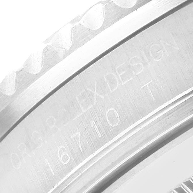 The image shows a close-up of the engraved case back bezel of the Rolex GMT-Master 16710 Men's Stainless Steel Black Dial 16710 Men's Stainless Steel Black Dial model 16710.