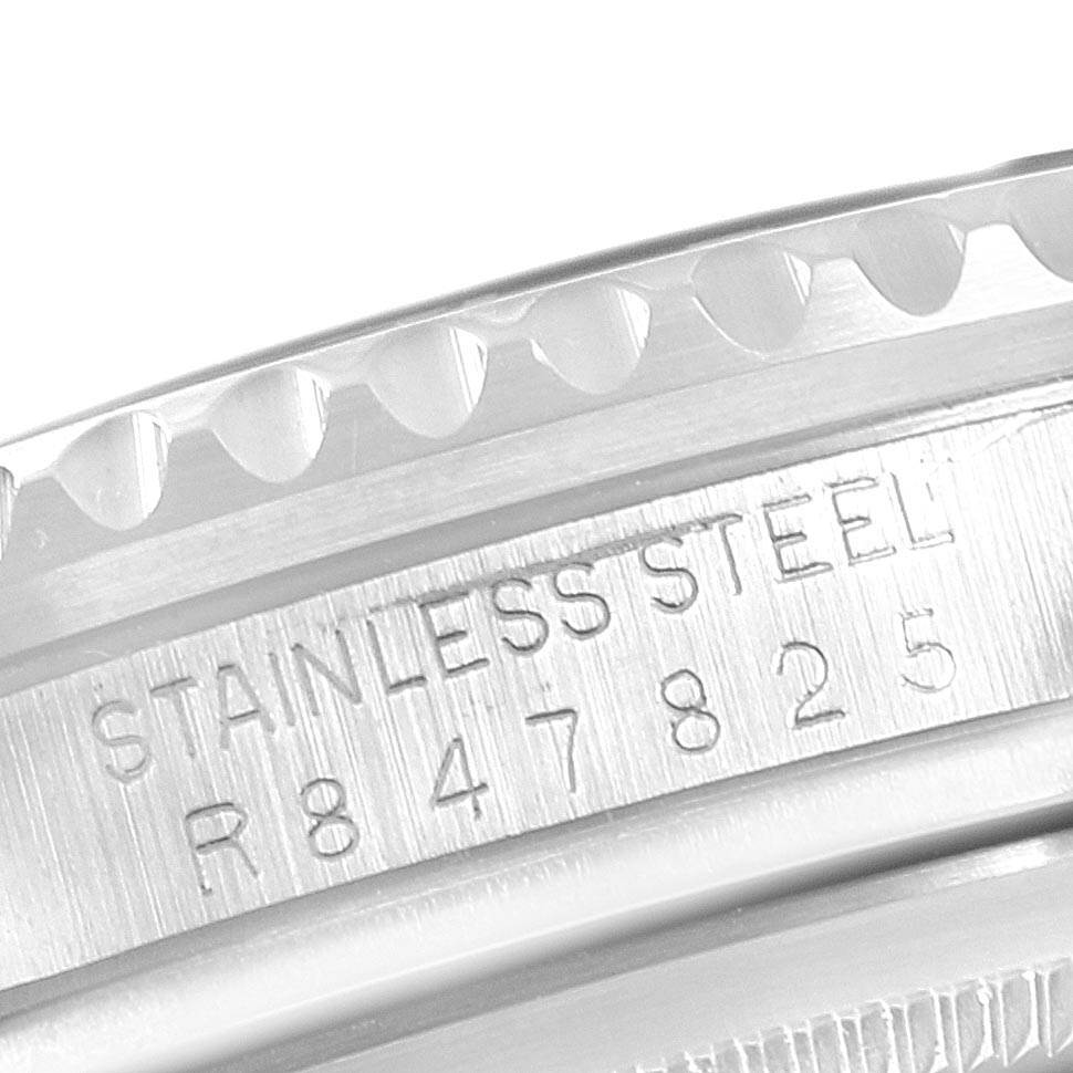 The image shows a close-up of the case side detailing the serial number and material for a Rolex GMT-Master 16710 Men's Stainless Steel Black Dial 16710 Men's Stainless Steel Black Dial.