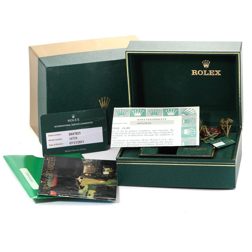 The image shows the packaging, manuals, guarantee card, and tags of a Rolex GMT-Master 16710 Men's Stainless Steel Black Dial 16710 Men's Stainless Steel Black Dial watch.