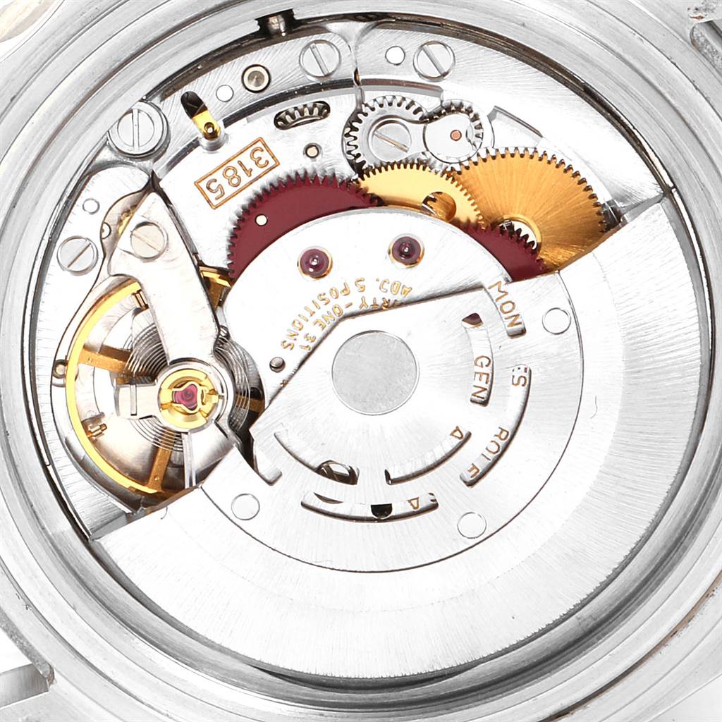This image shows the internal mechanism of a Rolex GMT-Master 16710 Men's Stainless Steel Black Dial 16710 Men's Stainless Steel Black Dial watch, viewed from the back exposing gears and movement parts.