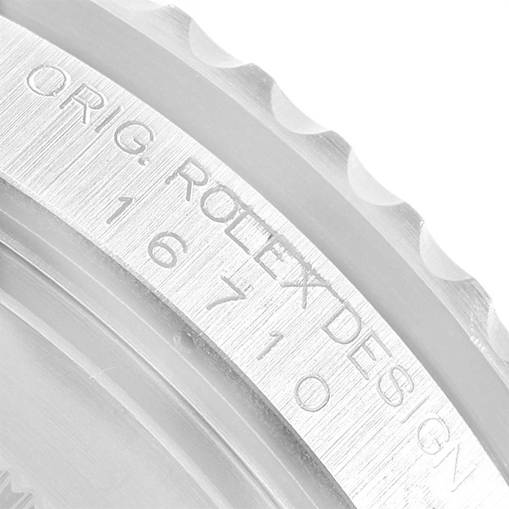 The image shows an angled close-up of the case engraving on a Rolex GMT-Master 16710 Men's Stainless Steel Black Dial 16710 Men's Stainless Steel Black Dial model, displaying the serial number and "ORIG. ROLEX DESIGN."