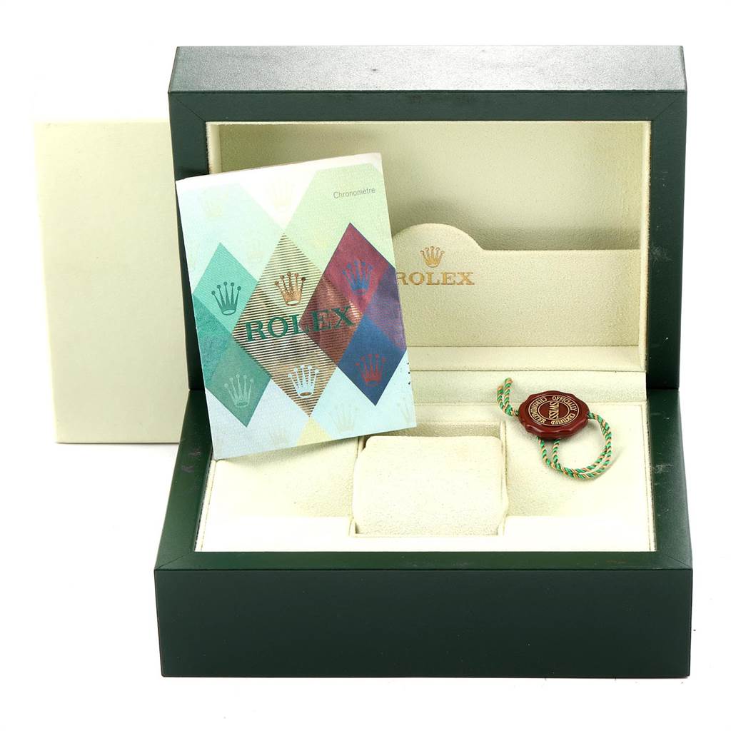 The image shows a Rolex GMT-Master 16710 Men's Stainless Steel Black Dial 16710 Men's Stainless Steel Black Dial watch box with a booklet and a green and red tag inside.