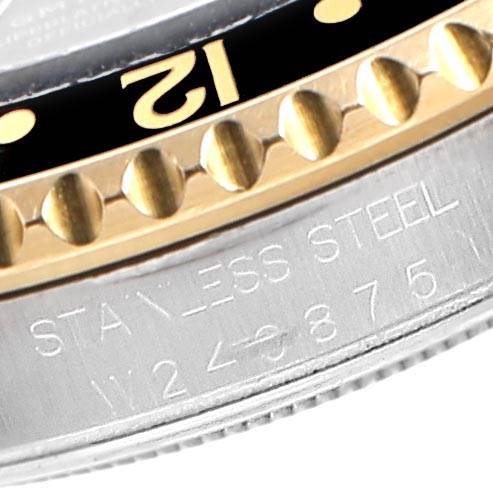 Close-up of a Rolex GMT-Master 16713 Men's Stainless Steel Black Dial 16713 Men's Stainless Steel Black Dial watch showing the bezel and engraved stainless steel case.