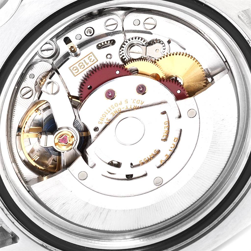 This image shows a close-up of the movement components of a Rolex GMT-Master 116710 Men's Stainless Steel Black Dial 116710 Men's Stainless Steel Black Dial watch, highlighting gears and the rotor.