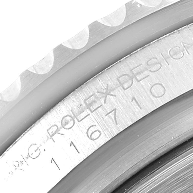 This image shows a close-up of the engraved reference number on a Rolex GMT-Master 116710 Men's Stainless Steel Black Dial 116710 Men's Stainless Steel Black Dial watch bezel.