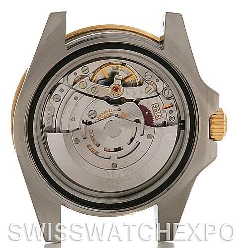 The image shows the back view of a Rolex GMT-Master 116713 Men's Stainless Steel Black Dial 116713 Men's Stainless Steel Black Dial watch case, highlighting its movement and internal mechanism.