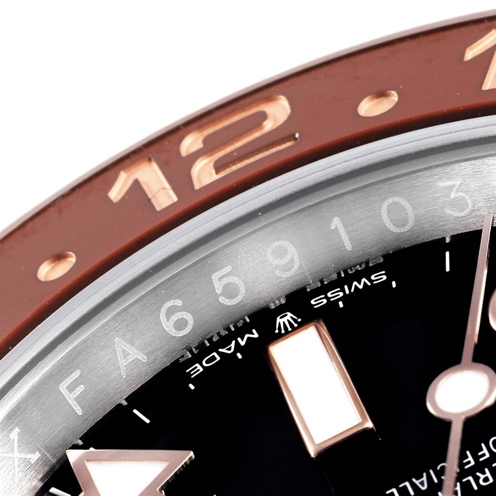 This image shows a close-up of the bezel and partial dial of the Rolex GMT-Master 126711 Men's Steel and Gold (two tone) Black Dial 126711 Men's Steel and Gold (two tone) Black Dial watch, highlighting the numbers and hour markers.