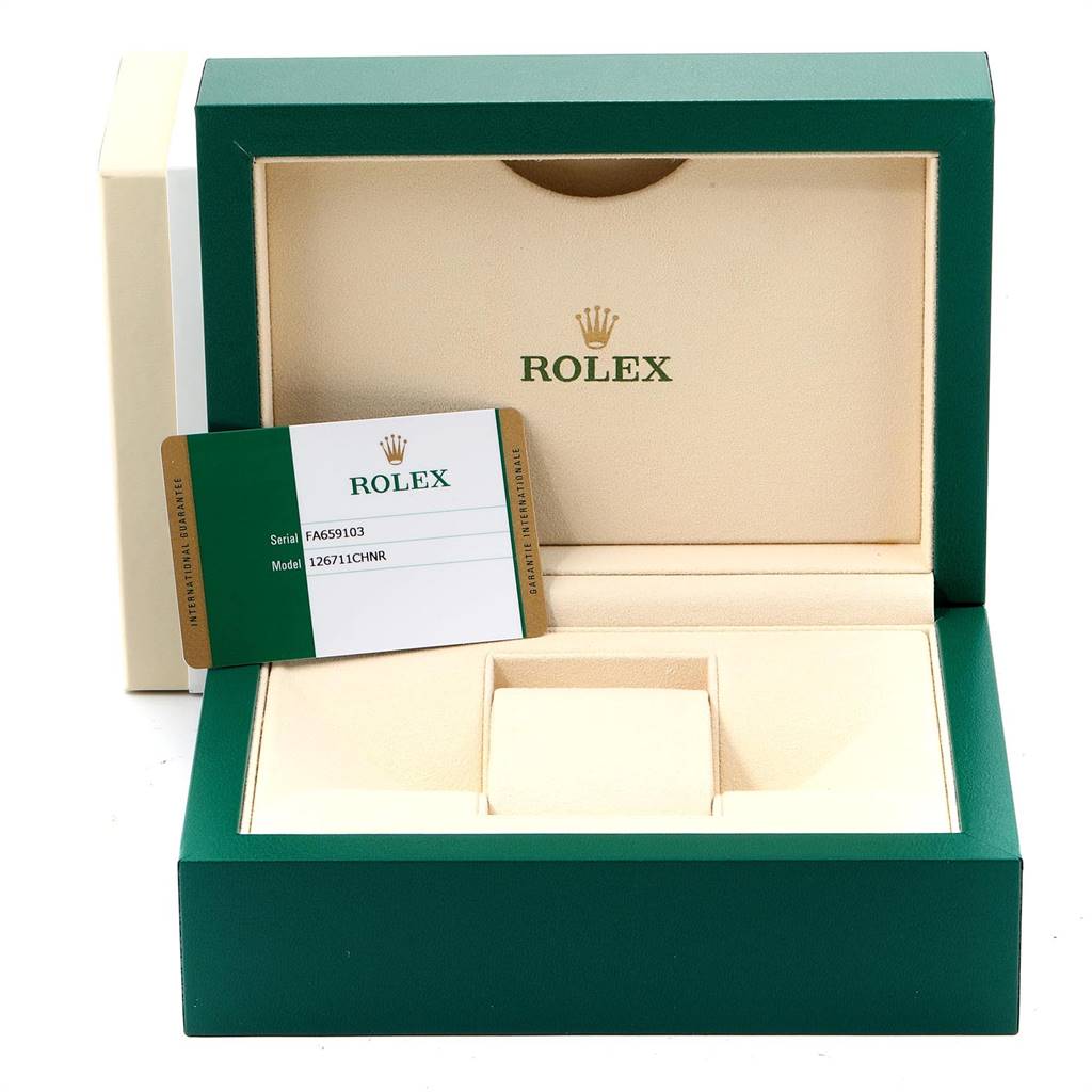 The image shows the open box and warranty card of a Rolex GMT-Master 126711 Men's Steel and Gold (two tone) Black Dial 126711 Men's Steel and Gold (two tone) Black Dial watch, angled to display the interior.