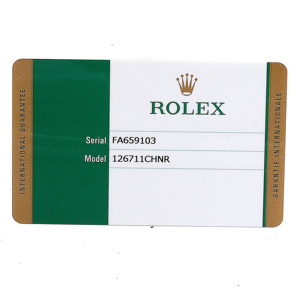 The image shows a Rolex warranty card for the GMT-Master model, displaying the serial number and model number.