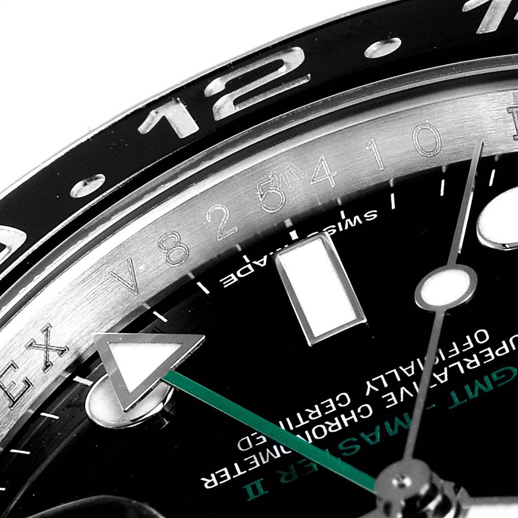 This image shows a close-up of the dial and bezel of a Rolex GMT-Master 116710 Men's Stainless Steel Black Dial 116710 Men's Stainless Steel Black Dial II watch, highlighting the 24-hour hand and details on the face.