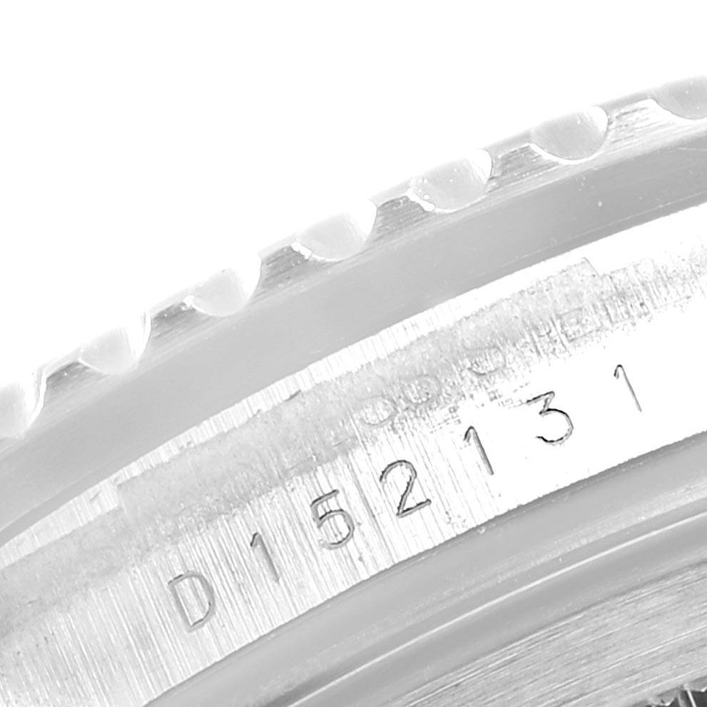 This image shows a close-up of the serial number engraving on the case of the Rolex GMT-Master 16710 Men's Stainless Steel Black Dial 16710 Men's Stainless Steel Black Dial watch.