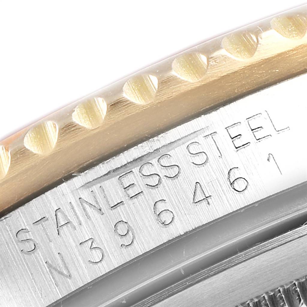 The image shows a close-up of the side of a Rolex GMT-Master 16713 Men's Stainless Steel Brown Dial 16713 Men's Stainless Steel Brown Dial, focusing on the stainless steel and part of the bezel.