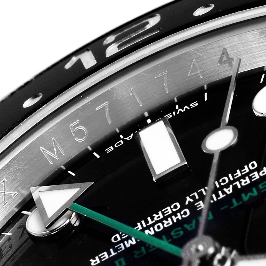The close-up image of the Rolex GMT-Master 116710 Men's Stainless Steel Black Dial 116710 Men's Stainless Steel Black Dial watch shows the bezel, part of the dial, and the hands, including the GMT hand.
