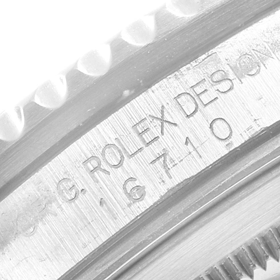 This image shows a close-up of the case side and bezel edge of a Rolex GMT-Master 16710 Men's Stainless Steel Black Dial 16710 Men's Stainless Steel Black Dial model, displaying engraving details.