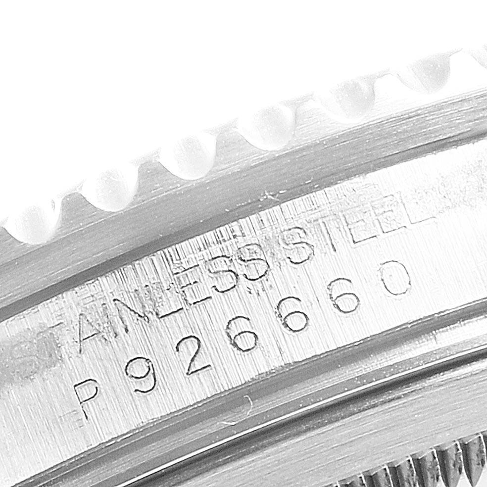 This close-up image shows the serial number and "STAINLESS STEEL" engraving on the case of a Rolex GMT-Master 16710 Men's Stainless Steel Black Dial 16710 Men's Stainless Steel Black Dial watch.