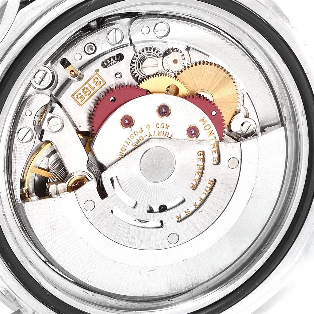 The image shows the movement mechanism of a Rolex GMT-Master 16710 Men's Stainless Steel Black Dial 16710 Men's Stainless Steel Black Dial watch, focusing on the intricate gears and components.