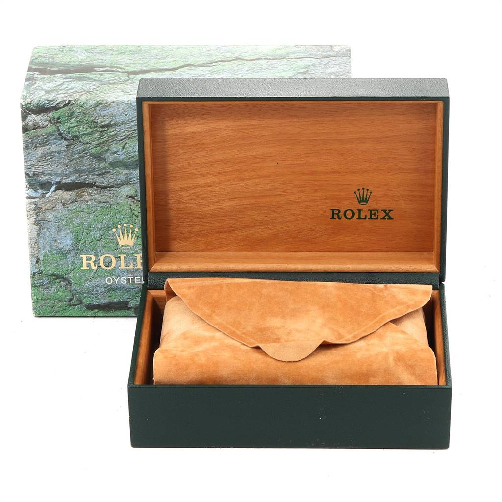 This image shows the open box of a Rolex GMT-Master 16710 Men's Stainless Steel Black Dial 16710 Men's Stainless Steel Black Dial, featuring the inner wooden lining and a suede pouch.