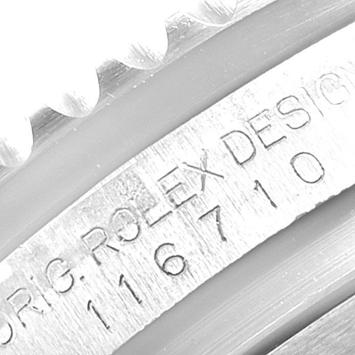Close-up of the side engraving on a Rolex GMT-Master 116710 Men's Stainless Steel Black Dial 116710 Men's Stainless Steel Black Dial model watch, showing part of its serial number and design details.