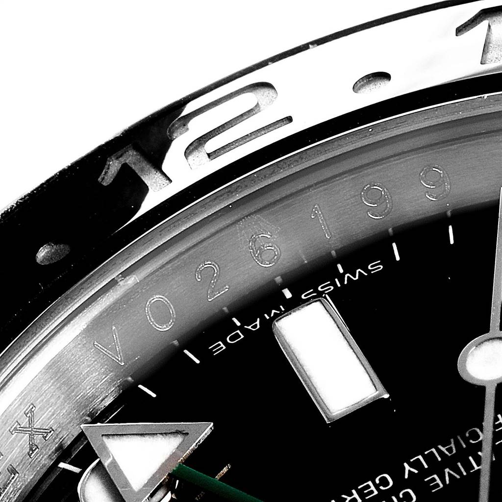 The close-up image shows the upper part of the Rolex GMT-Master 116710 Men's Stainless Steel Black Dial 116710 Men's Stainless Steel Black Dial watch dial, highlighting the 12 o'clock position, bezel, and indices.