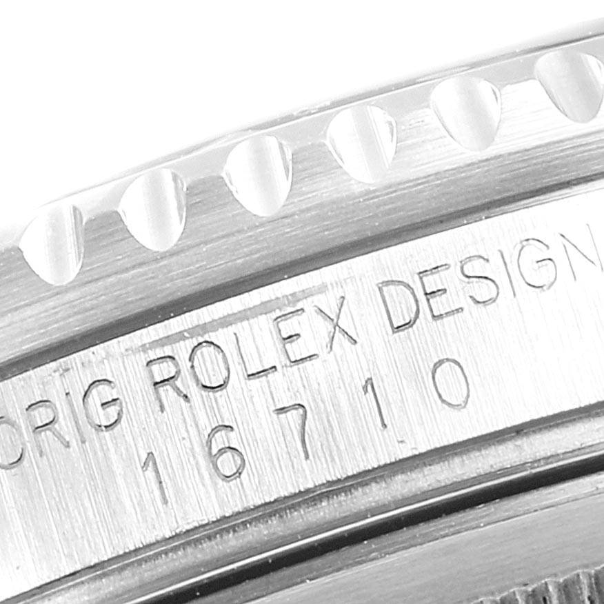 The image shows a close-up angle of the side of a Rolex GMT-Master 16710 Men's Stainless Steel Black Dial 16710 Men's Stainless Steel Black Dial watch, highlighting the bezel and engraved model number 16710.