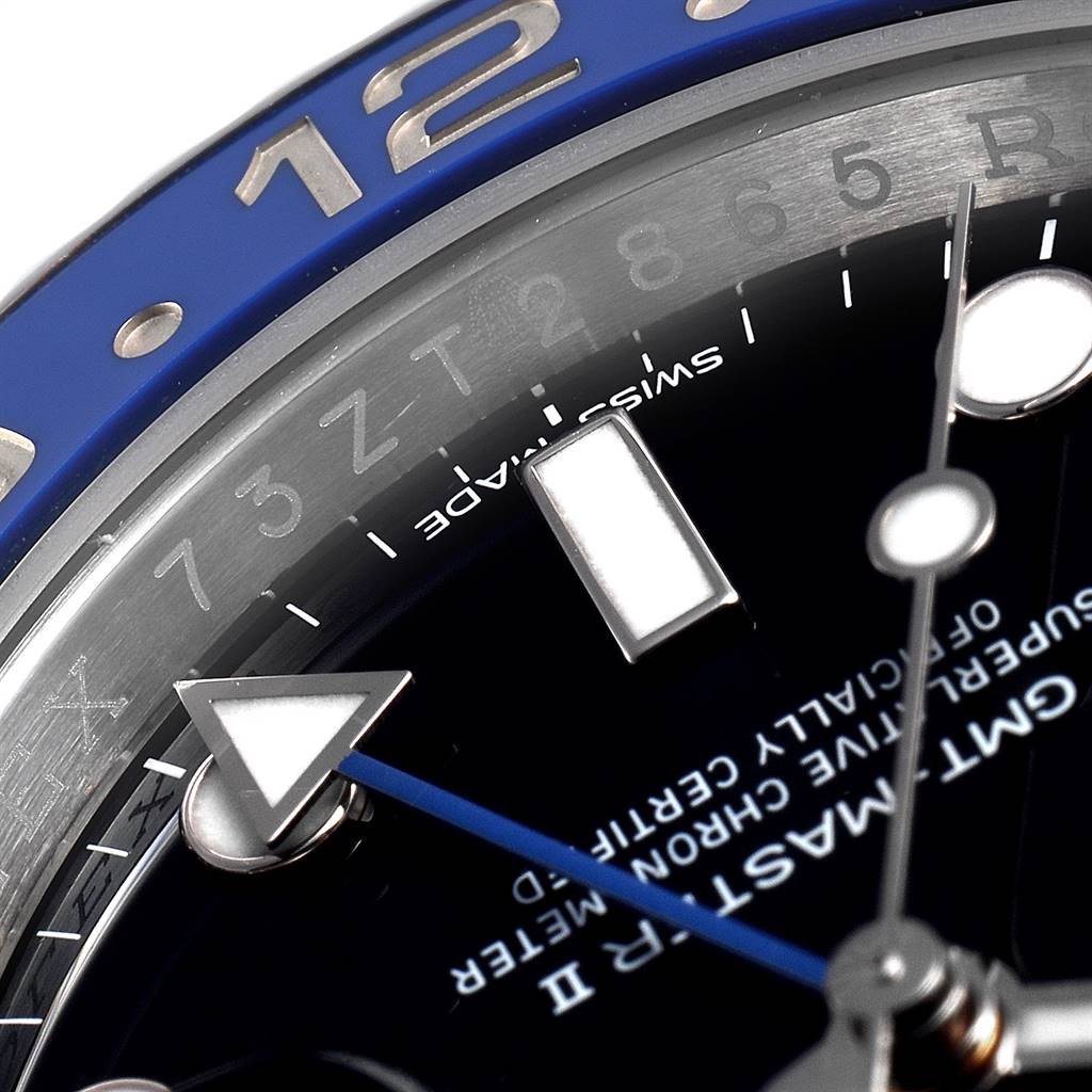 This close-up image of a Rolex GMT-Master 116710 Men's Stainless Steel Black Dial 116710 Men's Stainless Steel Black Dial watch highlights the bezel, hour markers, and a portion of the dial.