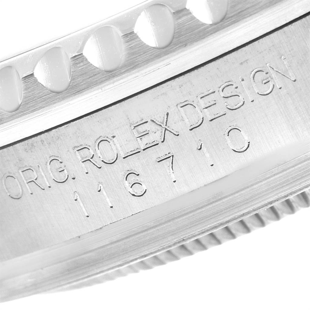 Close-up view of the side of a Rolex GMT-Master 116710 Men's Stainless Steel Black Dial 116710 Men's Stainless Steel Black Dial showing the model number and part of the bezel with a serrated edge.