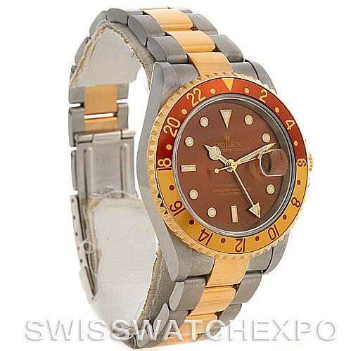 The image shows a side angle of the Rolex GMT-Master 16713 Men's Stainless Steel Brown Dial 16713 Men's Stainless Steel Brown Dial watch, highlighting its two-tone bracelet, brown dial, and red and gold bezel.