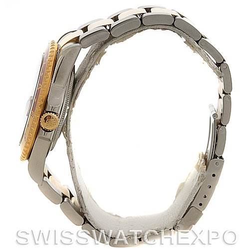 Side view of the Rolex GMT-Master 16713 Men's Stainless Steel Brown Dial 16713 Men's Stainless Steel Brown Dial watch showcasing the bracelet, crown, and partial bezel.