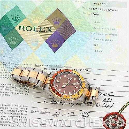 The image shows a Rolex GMT-Master 16713 Men's Stainless Steel Brown Dial 16713 Men's Stainless Steel Brown Dial watch at an angled view alongside its certificate and accompanying documents.